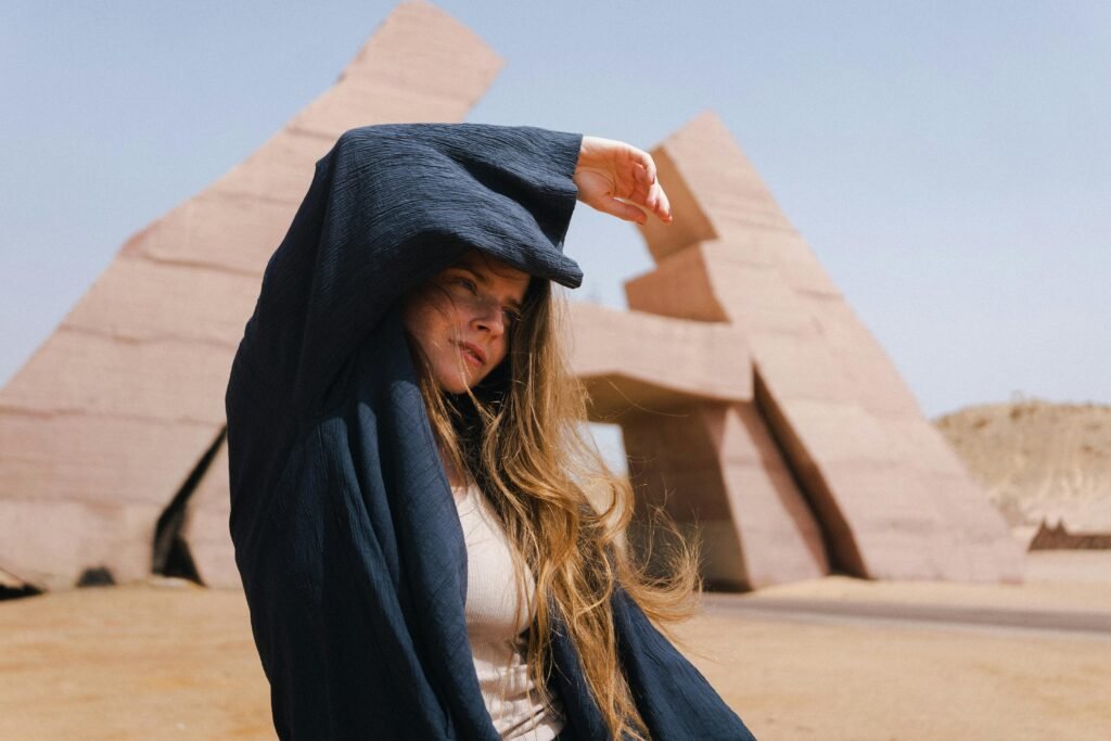 Woman stands at Ras Mohamed Nature Reserve in Egypt, posing stylishly.